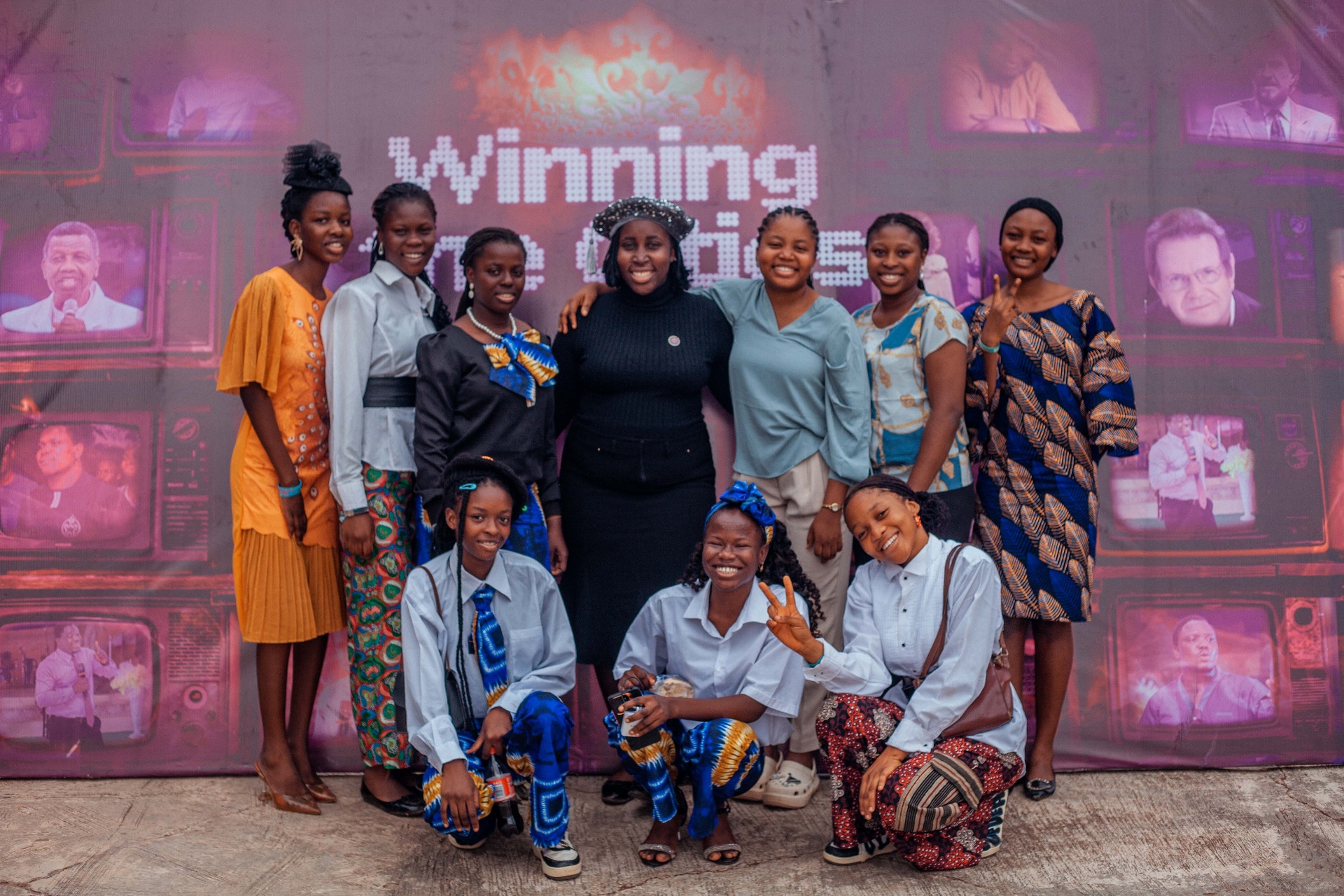 Group of sisters at the Winning the Cities photo wall