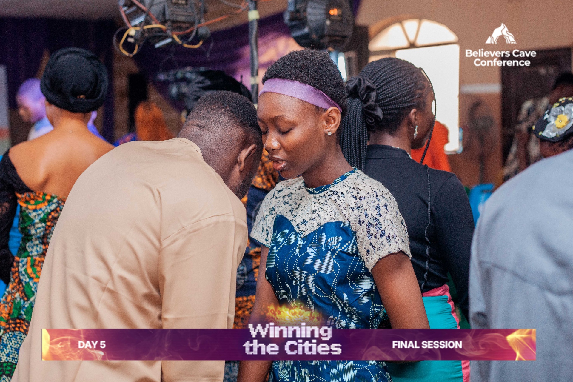 Attendees receiving prayer at the final session